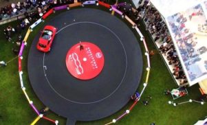 Watch a giant vinyl get played by a car