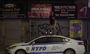 Azealia Banks dances on an NYPD car in the video for ‘The Big Big Beat’